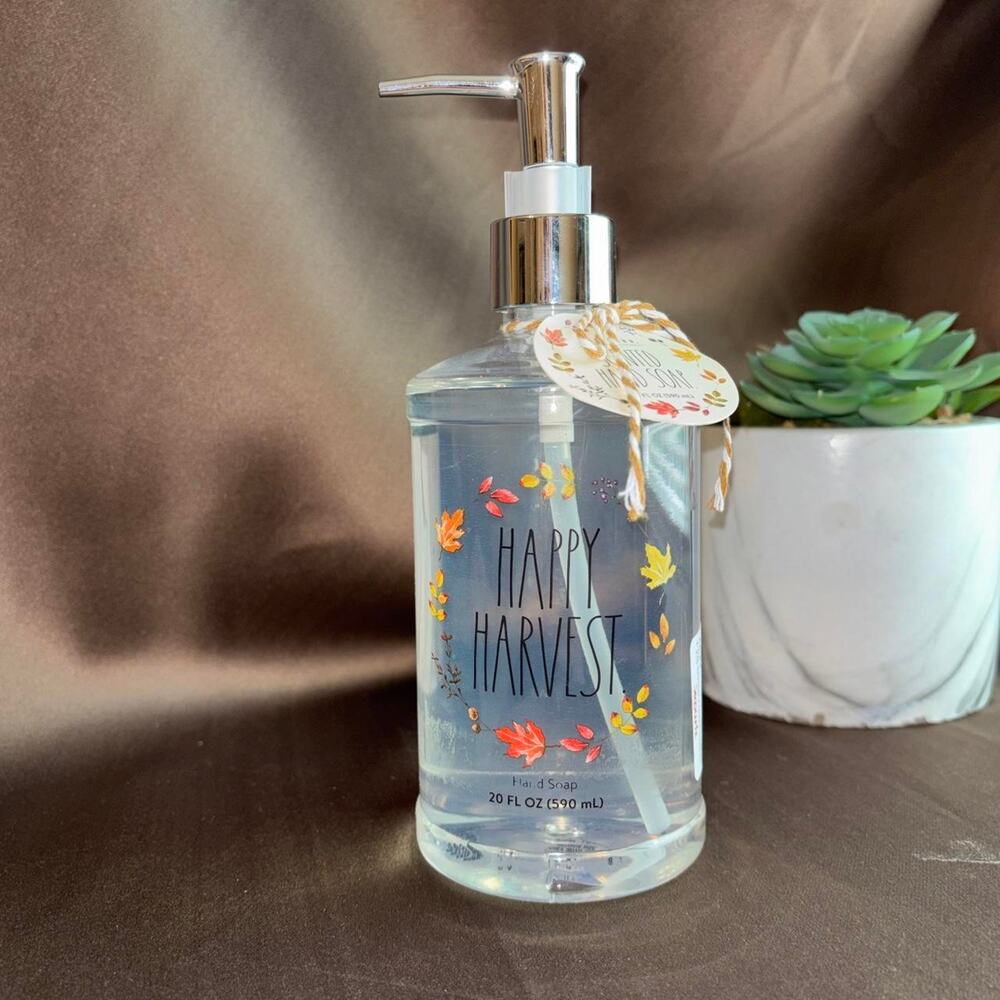Rae Dunn White refillable soap dispenser with honey  hand soap